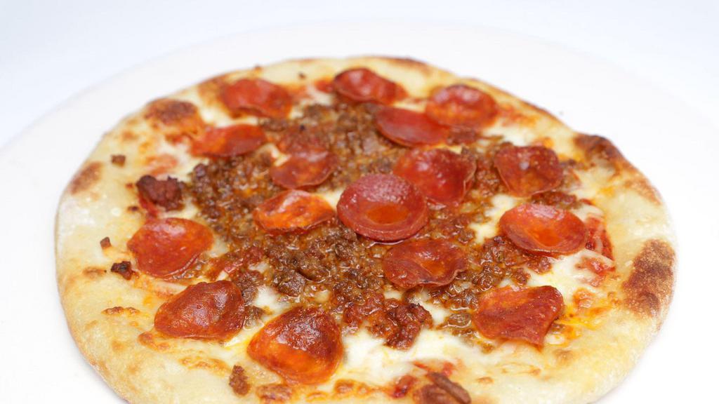 Carnivore Pizza · free range bolognese, nitrate free sausage & pepperoni, mozzarella, organic pizza sauce