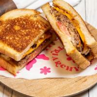 Earth Melting Patty Melt · Our Juicy Patty Sandwiched between Grilled Onions, 3 Melted Cheezes, Tomato, Mustard Aioli, ...