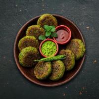 Pan-Fried Vegetarian Kabab · Pan-fried spiced patties made with a mix of spinach, green peas and potatoes.
