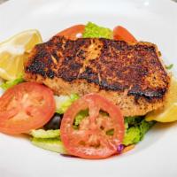 Blackened Salmon Salad · Fresh 8 oz salmon seasoned with Cajun spices and cooked to perfection. Served over mixed let...