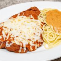 Chicken Parmigiana · A tender chicken breast lightly breaded, pan fried and covered with our traditional marinara...