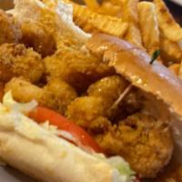 Po - Boys · A traditional French roll with lettuce, tomato and Cajun aioli. Your choice cole slaw, potat...