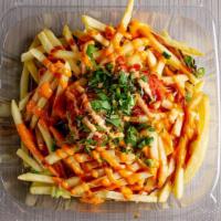 Spicy Tuna Fries · Fries top with spicy tuna, green onion, cilantro, eel sauce and spicy mayo.