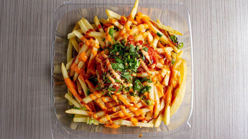Spicy Tuna Fries · Fries top with spicy tuna, green onion, cilantro, eel sauce and spicy mayo.
