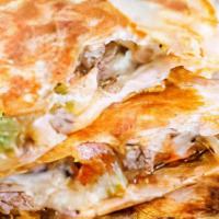 Quesadilla · Flour tortilla, choice of meat, melted cheese. On the side: guacamole, lettuce and sour cream.