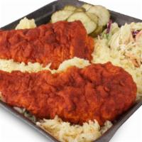 Combo 4 · Two Chicken Tenders over a buttery rice topped with slaw and pickles