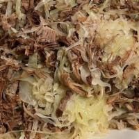 Kalua Pork With Cabbage · Smoke flavour succulent pork slowly roasted to perfection. A true island favourite.