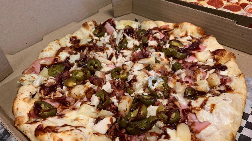 Spicy Bbq Hawaiian · White sauce, cheese, Canadian bacon, pineapple, jalapeño, bacon, chicken drizzled with BBQ sauce.