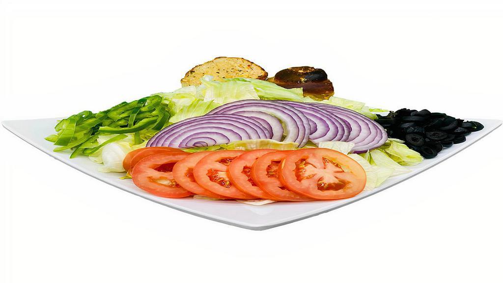 Bravo House Salad · Crispy Iceberg lettuce, Tomatoes, Red Onions, Bell Peppers and Black Olives.