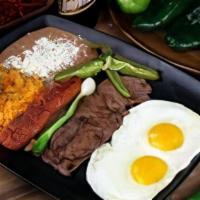 The Hungry Breakfast/ Super Almuerzo · Hungry? This breakfast has it all!! Two eggs choice of style, served with asada, chorizo, ri...