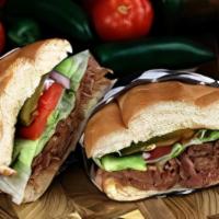 Torta En Telera / Classic Torta · Classic Mexican style sandwich with refried beans and topped with lettuce, tomato, onion, ja...