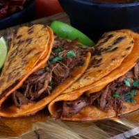 Taco De Barbacoa (1 Taco) · A house favorite!!! Delicious taco made with two large corn tortillas dipped in barbacoa bro...
