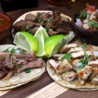 Street Tacos · order of 3 street Tacos.  Made with two corn tortillas and topped with the meat of your choi...