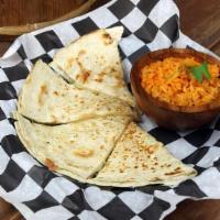 Quesadilla · One flour quesadilla served with rice or beans.
