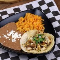 Taco Suave Con Arroz Y Frijoles · One taco suave served with rice and beans.