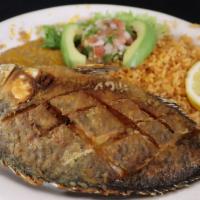 Mojarra Frita · Delicious fried mojarra (whole tilapia Fish) Served with rice,baens, pico de gallo, avocado ...