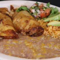 Enchiladas A La Plancha · Two enchiladas filled with cheese & carne asada Served with rice, beans Garnished withe pico...