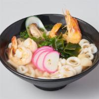 Seafood Noodle Soup · udon, assorted seafood, fish cake, seaweed, green onion in clear dashi soup