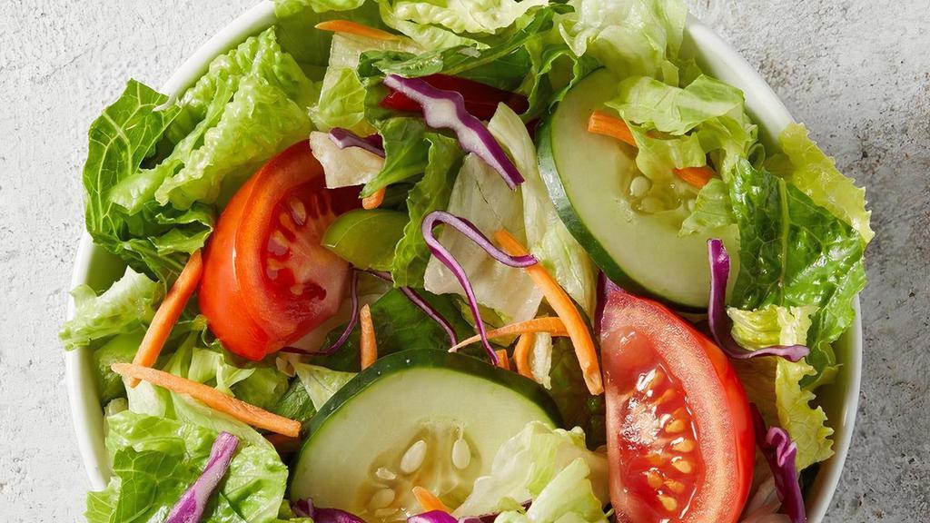 Garden Salad · Served fresh and crisp, this salad is filled with fresh juicy tomatoes, cucumbers, romaine and iceberg lettuce, with shredded cabbage and carrots..