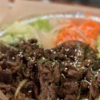 Bulgogi Short Rib Steak Bowl · served on jasmine rice with a side of mixed vegetables and our house black sauce