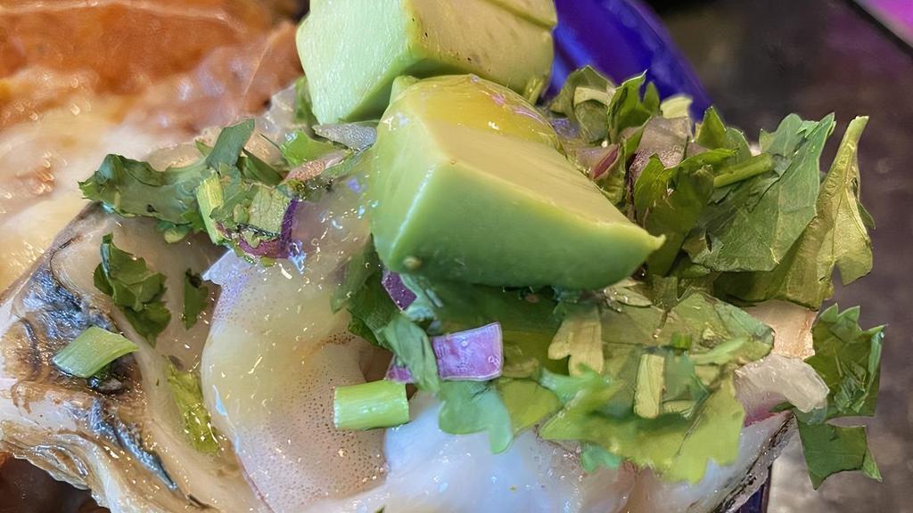 Ostiones Los Panchos · Raw oysters on the half shell, aguachile-style shrimp, limejuice, avocado, onion, cilantro, salsas aguachile (lime, mango and pineapple).