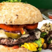 The Classic · 100% fresh grass finished beef, red onions, tomatoes, lettuce, mustard, pickles, and house m...