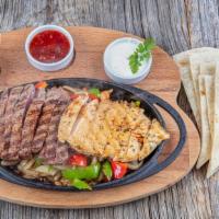 Fajitas Combo Plate · Choice of marinated protein, served with Spanish rice, refried beans, salad, and corn tortil...