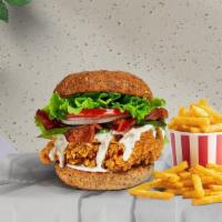The Bacon Bird · Crispy fried chicken with bacon, shredded romaine, tomato, pickles, and a special aioli sauc...