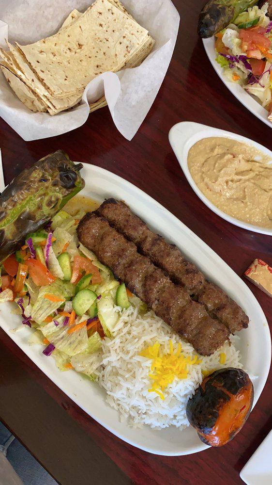 Luleh Kebab · Two skewers ground beef, mixed with spices and charbroiled.