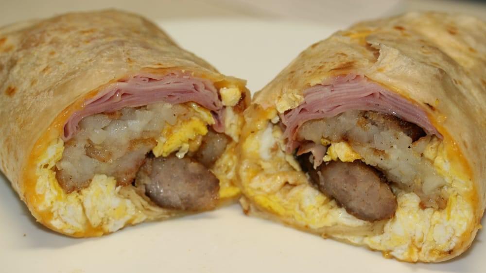 Ultimate Breakfast Burrito · 3 eggs, ham, sausage, bacon, cheese and hash brown inside.