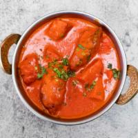 Chicken Tikka Masala · Barbecued boneless chicken breast sautéed with herbs and spices.