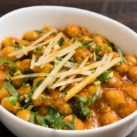 Chana Masala · Chickpeas cooked with onions, tomatoes and spices.