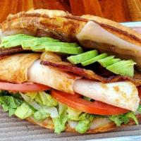 Roasted Turkey Club · Applewood Smoked Bacon, Swiss Cheese, Avocado, Tomato, Romaine, Pesto Aioli