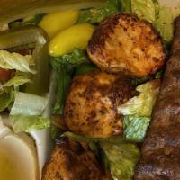 Beef Lula Kebab Plate · Served with rice, salad, hummus and pita bread.