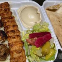 Chicken Combo Kebab Plate · Served with rice, salad, hummus and pita bread.