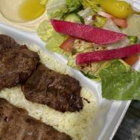 Beef Combo Kebab Plate · Served with rice, salad, hummus and pita bread.