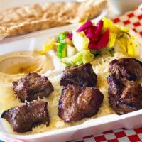 Beef Shish Kebab Plate · Served with rice, salad, hummus and pita bread.