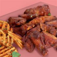 Dozen Chicken Wings Pack · Marinated Chicken Wings, Served with Waffle Fries, Choice of Sauce.
