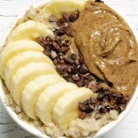 Almond Butter Banana Oats · Vanilla steel cut oats with housemade cashew milk, topped with bananas, mood-boosting cacao ...