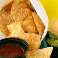 Chips & Salsa · Our warm, flakey and crunchy tortilla chips, comes with our homemade salsa verde and salsa r...