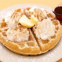 Side Belgian Waffle · A waffle topped with whipped cream, powdered sugar, and cinnamon.