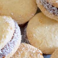 Alfajores · 6 PIECES.  dessert with two melt-in-your-mouth cookies with dulce de leche sandwiched in bet...