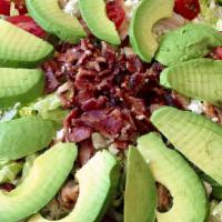 Cobb Salad · Crisp romaine hearts, grape tomatoes, crumbled blue cheese, hard boiled eggs, apple wood bac...