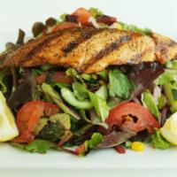 Salmon Salad · Grilled salmon brushed with lemon herb, served on organic baby field greens, Persian cucumbe...