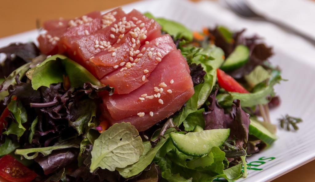Seared Tuna Salad · Organic baby field greens, julienne cut carrots, grape tomatoes, persian cucumbers, scallions, topped with seared tuna, and hass avocado served with our ponzu dressing.