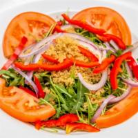 Quinoa Salad · Arugula, quinoa, tomatoes, red onions, bell pepper, cilantro lime dressing.