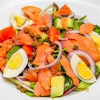 Smoked Salmon Salad · Mixed green lettuce, smoked salmon, red onions, tomatoes, cucumbers, capers, boiled egg, hon...