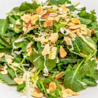 Kale Salad · Cabbage, green onions, cilantro, mint, almonds, honey lime dressing.