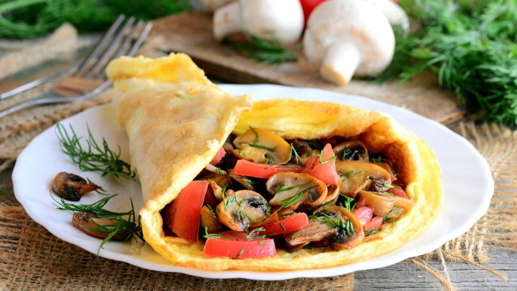 Veggie Omelette · Fresh eggs with your choice of veggies. Served with a side of white rice and beans.
