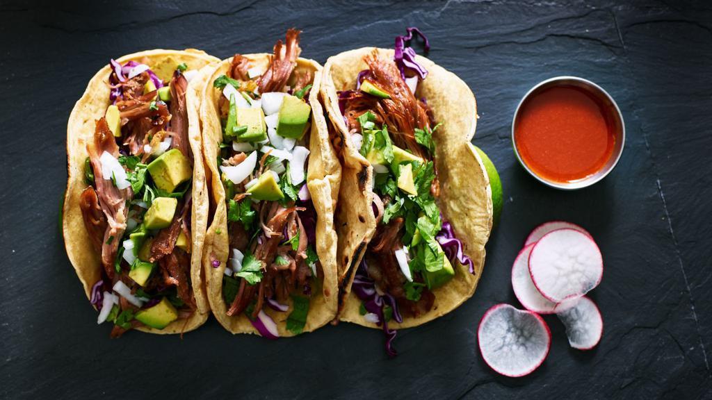 Deep Fried Pork(Carnitas) Tacos · Fried pork, onions, and cilantro sitting on a warm homemade tortilla.